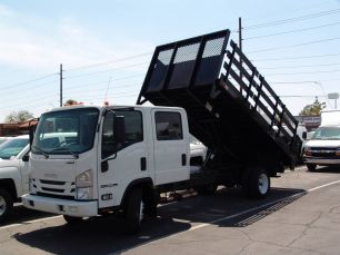 Photo of a  Isuzu NPRHD Crew Cab Stake Bed Dump with Tilting lift gate